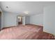 Large bedroom with ensuite bathroom with carpet flooring at 324 Swamp Fox Dr, Fort Mill, SC 29715
