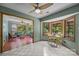 A breakfast nook sits adjacent to a sunroom in this bright and airy home at 324 Swamp Fox Dr, Fort Mill, SC 29715