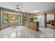 Inviting kitchen with a breakfast nook, green countertops, and wood cabinets, perfect for casual dining at 324 Swamp Fox Dr, Fort Mill, SC 29715