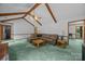 Inviting living room with vaulted ceilings, wood beams, cozy seating, and warm natural light at 324 Swamp Fox Dr, Fort Mill, SC 29715