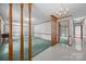 Spacious living room featuring carpet, chandelier, and decorative columns at 324 Swamp Fox Dr, Fort Mill, SC 29715