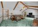 Relaxing living room featuring vaulted ceilings, beams, and comfortable seating with a view into the kitchen at 324 Swamp Fox Dr, Fort Mill, SC 29715
