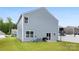 The house's backyard features a grill, sliding door, and a basketball hoop at 3734 Stanley Creek Dr, Mount Holly, NC 28120