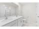 Bright bathroom featuring double sink vanity with white cabinets, and tile flooring at 3734 Stanley Creek Dr, Mount Holly, NC 28120