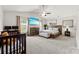 Spacious main bedroom with vaulted ceilings, soft carpet, crib, and a ceiling fan at 3734 Stanley Creek Dr, Mount Holly, NC 28120