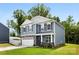 Beautiful two-story home featuring a well-kept lawn, stone accents, and a welcoming front entrance at 3734 Stanley Creek Dr, Mount Holly, NC 28120