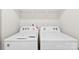 Bright laundry room featuring a side-by-side washer and dryer at 3734 Stanley Creek Dr, Mount Holly, NC 28120