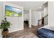 Bright living room with hardwood floors, a TV, and a view into another sitting area at 3734 Stanley Creek Dr, Mount Holly, NC 28120