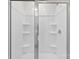 Clean, bright shower enclosure with built in shelving at 3734 Stanley Creek Dr, Mount Holly, NC 28120