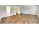 Open room with hardwood floors and open doorway to bathroom at 3855 Tersk Dr, Midland, NC 28107