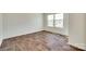 Bedroom features hardwood floors and large windows with blinds at 3855 Tersk Dr, Midland, NC 28107