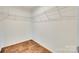 Walk-in closet featuring wood floor and wire shelving at 3855 Tersk Dr, Midland, NC 28107