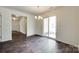 Dining room with a sliding glass door and wood-look flooring at 3855 Tersk Dr, Midland, NC 28107