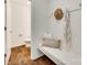 Entryway with bench seating, hat rack, and a view into a half-bathroom at 3855 Tersk Dr, Midland, NC 28107