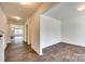 Bright entryway featuring sleek hardwood floors, neutral walls, and open sightlines into a spacious living area at 3855 Tersk Dr, Midland, NC 28107