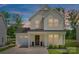 Charming two-story home showcasing a well-manicured lawn and an attached garage, perfect for a Gathering at 3855 Tersk Dr, Midland, NC 28107
