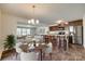 Inviting eat-in kitchen with stainless steel appliances and a dining area with seating and living room view at 3855 Tersk Dr, Midland, NC 28107
