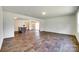 Open living area with wood floors, kitchen island and dining area visible at 3855 Tersk Dr, Midland, NC 28107