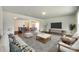 Stylishly furnished living room with a decorative rug and a seamless connection to the kitchen and dining spaces at 3855 Tersk Dr, Midland, NC 28107