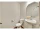 Well-lit powder room featuring a pedestal sink and charming decor at 3855 Tersk Dr, Midland, NC 28107