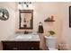 This bathroom features a lovely granite countertop, a brown vanity, and a classic towel hanger at 394 E Goldmine Rd, Wadesboro, NC 28170