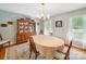 Traditional dining room featuring a china cabinet, light blue walls, and traditional chandelier at 394 E Goldmine Rd, Wadesboro, NC 28170