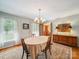 Traditional dining room featuring an area rug and a vintage sideboard at 394 E Goldmine Rd, Wadesboro, NC 28170