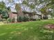 Charming brick home with manicured lawn and mature trees at 394 E Goldmine Rd, Wadesboro, NC 28170