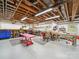 This spacious garage features a lot of space, overhead lighting, and tool chests for storage at 394 E Goldmine Rd, Wadesboro, NC 28170