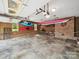 Organized garage with kayaks, bicycles, and ample storage space at 394 E Goldmine Rd, Wadesboro, NC 28170