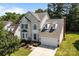 Aerial perspective of a two-story home showcasing its architectural design, landscaping, and driveway at 4519 Rock Stream Dr, Charlotte, NC 28269
