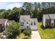 Aerial shot of a two-story home with a well-manicured lawn and mature trees in the backyard at 4519 Rock Stream Dr, Charlotte, NC 28269