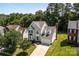Two-story home with a well-maintained yard, two-car garage, and mature trees creating privacy at 4519 Rock Stream Dr, Charlotte, NC 28269
