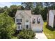 Overhead view of a home highlighting its architectural style, landscaping, and backyard trees at 4519 Rock Stream Dr, Charlotte, NC 28269