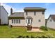 A view of the house from the backyard shows the brick foundation, siding, and well-kept lawn at 4519 Rock Stream Dr, Charlotte, NC 28269