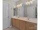 Double vanity bathroom with modern lighting and a spacious layout at 4519 Rock Stream Dr, Charlotte, NC 28269