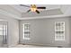 Spacious bedroom featuring a tray ceiling and plush carpeting at 4519 Rock Stream Dr, Charlotte, NC 28269