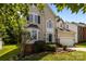 Two-story home with traditional architecture, well-kept landscaping, and a two-car garage at 4519 Rock Stream Dr, Charlotte, NC 28269