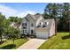 Inviting two-story home with a manicured lawn, two-car garage, and classic design elements at 4519 Rock Stream Dr, Charlotte, NC 28269