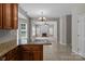 Open kitchen features granite countertops, tile flooring, and a view to the living area with fireplace at 4519 Rock Stream Dr, Charlotte, NC 28269