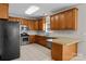 Functional kitchen with stainless steel appliances, granite countertops, and tile flooring, ideal for cooking at 4519 Rock Stream Dr, Charlotte, NC 28269