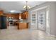 Bright kitchen boasts stainless steel appliances, ample cabinetry, and a cozy breakfast nook with backyard access at 4519 Rock Stream Dr, Charlotte, NC 28269