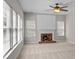 Inviting living room with a fireplace and bright windows at 4519 Rock Stream Dr, Charlotte, NC 28269