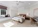Bedroom features neutral colors, a window seat, plush carpet, and modern decor at 4714 Ockley Manor Ln, Charlotte, NC 28226
