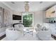 Sitting room with modern decor, large window, recessed lights, and a glass coffee table at 4714 Ockley Manor Ln, Charlotte, NC 28226