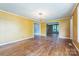 Bright living room featuring hardwood floors, large windows, and a modern chandelier at 537 N Main St, Mooresville, NC 28115