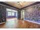 Spacious living room boasting hardwood floors, textured walls, and an open layout at 537 N Main St, Mooresville, NC 28115