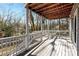 A spacious outdoor deck features wooden railing and scenic outdoor views at 6017 Millbury Ct, Charlotte, NC 28211