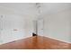 Bedroom with hardwood floors, ceiling fan, large closet, and ensuite access at 6017 Millbury Ct, Charlotte, NC 28211
