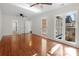 Bright bedroom with hardwood floors, ceiling fans, and natural light at 6017 Millbury Ct, Charlotte, NC 28211